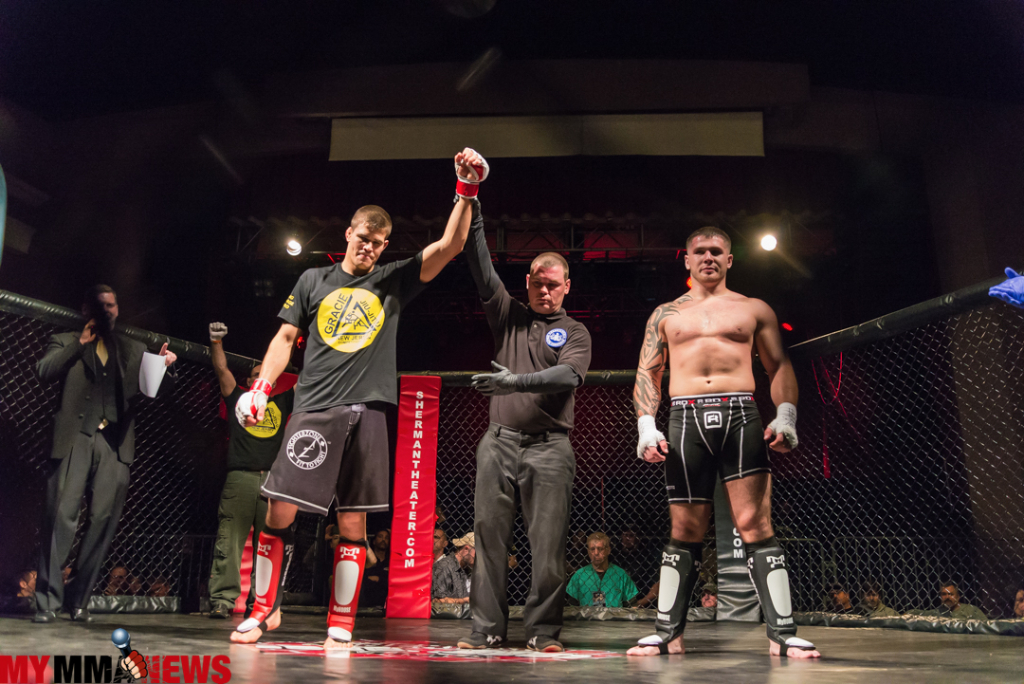 Hand raised after a regional win